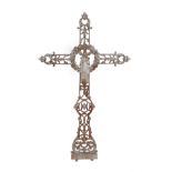 A Silver Painted Cast Iron Crucifix, late 19th century, of foliate and scroll pierced and cast form,