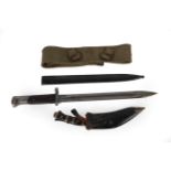 A First World War Mauser Bayonet and Scabbard, stamped CSZ/F, 45cm long; A Khaki Belt; and A Kukri