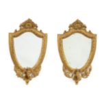 A Pair of Mid 19th Century Gilt and Gesso Girandole Mirrors, the original bevelled glass plates