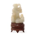 A Chinese Jade Figure Group, as a figure standing holding a vase of flowers, a child with a basket