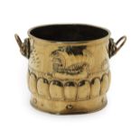 A Late 19th Century Circular Embossed Brass Coal Bucket, with lion mask loop handles, the body of