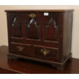 An Oak Mule Chest, 18th century and later, of small proportions, the hinged lid above triple