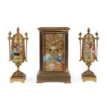 A Brass Porcelain Panelled Striking Mantel Clock Garniture, circa 1890, dial and side porcelain