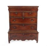 A Queen Anne Oak Straight Front Chest of Drawers, early 18th century, the moulded top above a frieze