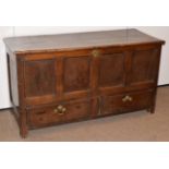 An Early 18th Century Joined Oak Chest, the hinged lid above four moulded panels with two deep