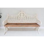 A White Painted Cast Metal Garden Bench, modern, with six wooden slats and a Gothic style back