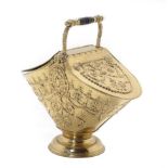 A Victorian Style Embossed Brass Coal Hod, with turned handle above two hinged lids decorated with