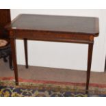 A George III Mahogany Side Table, late 19th century, the worn leather writing surface above a fluted