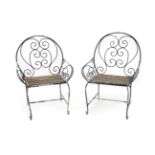 A Pair of Mid 20th Century French Wrought Iron Garden Seats, with scrolled back support and arms