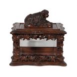 A French Carved Oak Casket, mid 19th century, of shaped rectangular form, surmounted by a