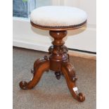 A Victorian Carved Walnut Revolving Piano Stool, 3rd quarter 19th century, recovered in beige velvet