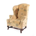 A Victorian Wing-Back Armchair, the rear leg stamped Howard & Sons Ltd, Berners Street 10147 4811,