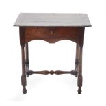 An 18th Century Joined Oak and Pine Lined Side Table, the three plank top above a single frieze