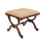 Kendell & Co: A Victorian Walnut Dressing Stool, circa 1850, the worn floral overstuffed seat within