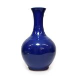 A Chinese Blue Glazed Porcelain Bottle Vase, 20th century, of ovoid form with trumpet neck, 39.5cm