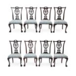 A Set of Eight Carved Mahogany Chippendale Style Dining Chairs, 19th century, recovered in blue