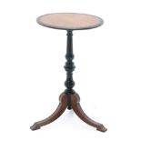 A Victorian Ebonised and Amboyna Circular Tripod Table, late 19th century, of circular form, on a