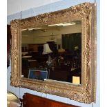 A gilt and gesso picture frame mirror, 100cm by 120cm