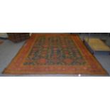 Ushak carpet, the field of serrated ruler of leaves enclosed by stylised vine borders, 358cm by