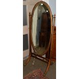 A mahogany cheval mirror, the oval bevelled plate on twin square tapered supports with urn