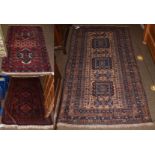 Baluch rug, the field with three serrated guls enclosed by narrow borders 195cm by 112cm, together