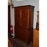A George III oak and burr walnut linen press, moulded cornice above twin handled drawers,