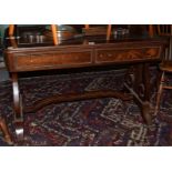 A mahogany writing table with lyre supports and stretcher, 112cm wide