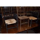 A set of five 19th century faux bamboo rush-seated chairs with spindle-backs, together with two