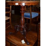 A 19th century mahogany table with inlaid satinwood, rosewood and walnut geometric top, carved