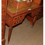 An Edwardian mahogany cross banded kneehole desk, green leather inset, four drawers with square