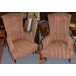 A pair of John Sankey button back upholstered armchairs