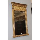 A Regency Egyptian Revival gilt wood pier glass mirror, 82cm high by 49cm wide