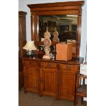 An early 20th century oak mirror backed sideboard with Art Nouveau stylised handles, 230cm high by