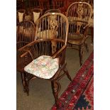 A pair of elm seated spindle back Windsor chairs, pierced splats, crinoline stretchers (2)