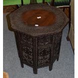 An Indian carved hardwood folding table