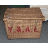 A large wicker laundry hamper