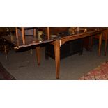A Provincial draw leaf farmhouse dining table, possibly French, 79cm by 230cm (extended)