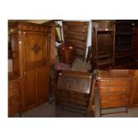 A 1920s oak single wardrobe and an oak bureau of similar taste, an oak four height chest, a