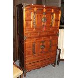 A Chinese two tier cabinet, mixed wood, arrangement of drawers, 169cm high