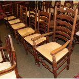 A set of six rush seated ladder back chairs including two carvers (6)