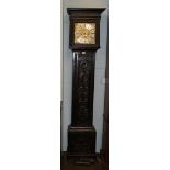 A carved oak eight day longcase clock, square dial with chapter ring bearing a later inscription,