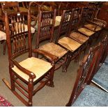 A set of four 19th century rush seated spindle back chairs, together with a similar carver,