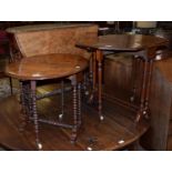 A Victorian burr walnut Sutherland table with an oval top on turned supports with porcelain castors,