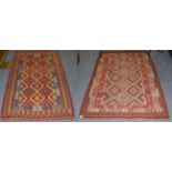 Afghan Kilim, the serrated diamond lattice field enclosed by geometric borders, together with