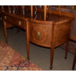 A George III mahogany and crossbanded bow front sideboard, single drawer flanked by cellarette