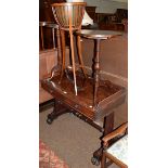 An early 19th century mahogany dressing table, three quarter gallery back, two drawers, raised on