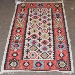 Turkish Kilim, ivory around hexagons, enclosed by backed motifs