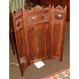 An Indian heavily carved folding screen
