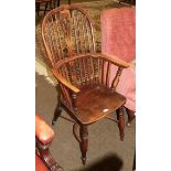 A 19th century elm seated stick back Windsor chair, pierced splat with crinoline stretcher