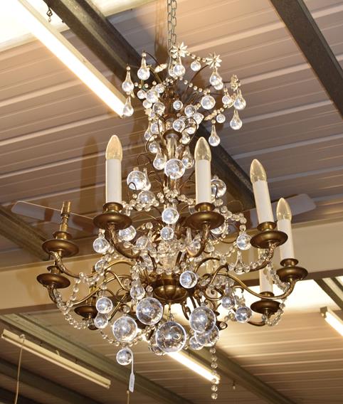 A ten-light gilt metal lustre drop chandelier
